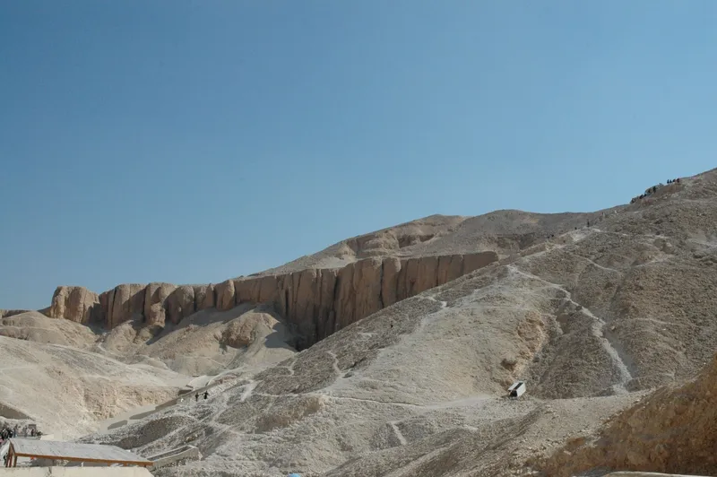 Panorama of the Valley of the Kings with paths up the limestone hillside