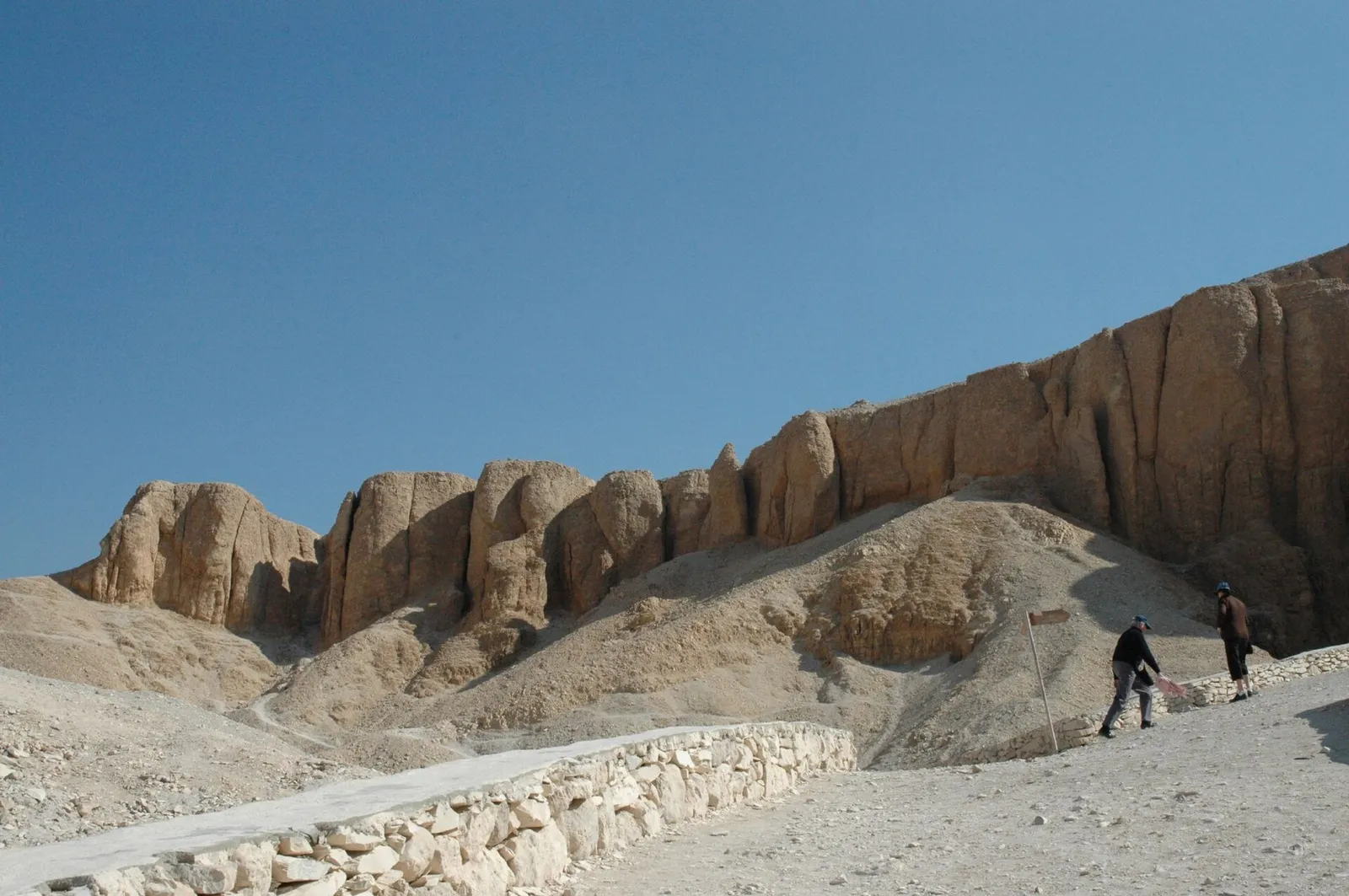 Limestone cliffs above a walled path in the Valley of the Kings