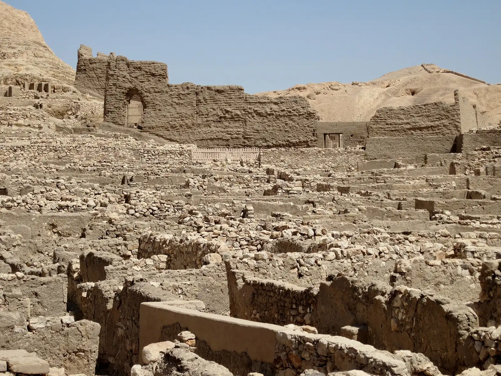 Mud-brick enclosure of the Ptolemaic temple above house ruins at Deir el-Medina