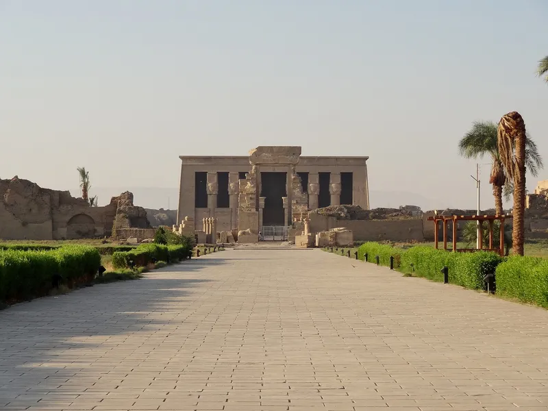 Paved approach to the Dendera temple, its columned facade straight ahead