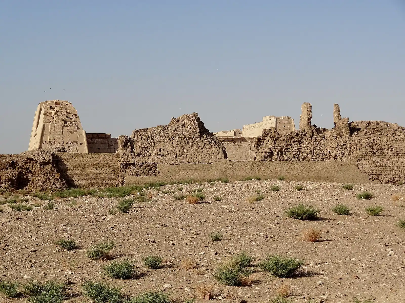 The pylon and mud-brick enclosure walls of Medinet Habu seen from the desert edge
