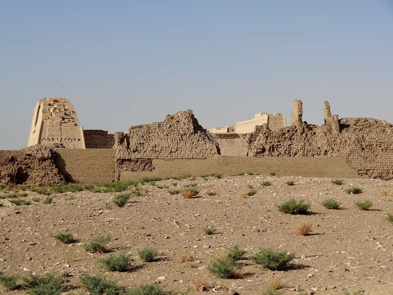 The pylon and mud-brick enclosure walls of Medinet Habu seen from the desert edge