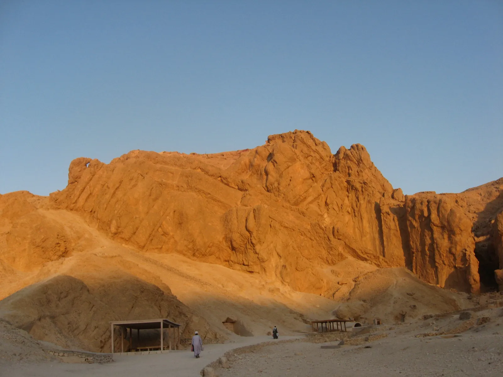 Golden cliffs above a path in the Valley of the Queens