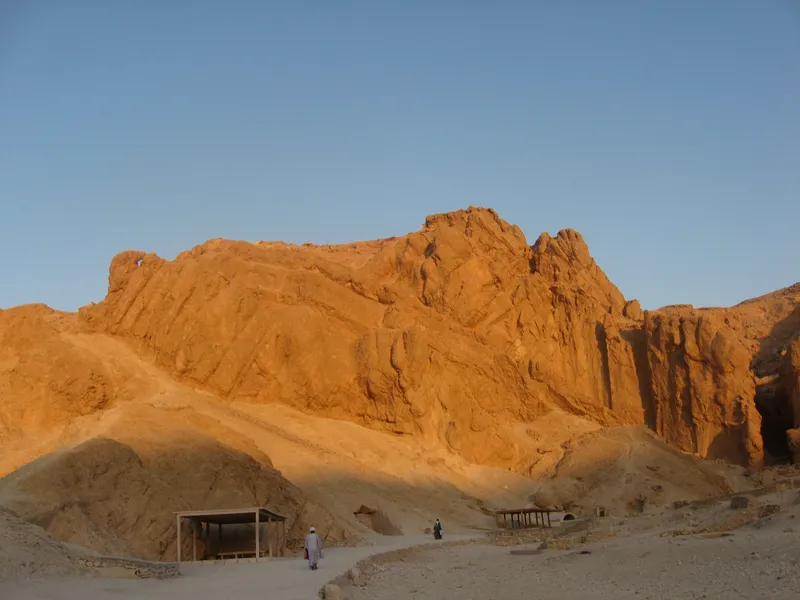 Golden cliffs above a path in the Valley of the Queens