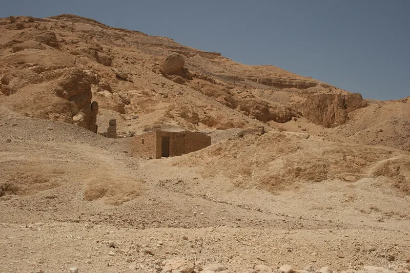 Small tomb entrance building on the rocky slope of the Valley of the Queens