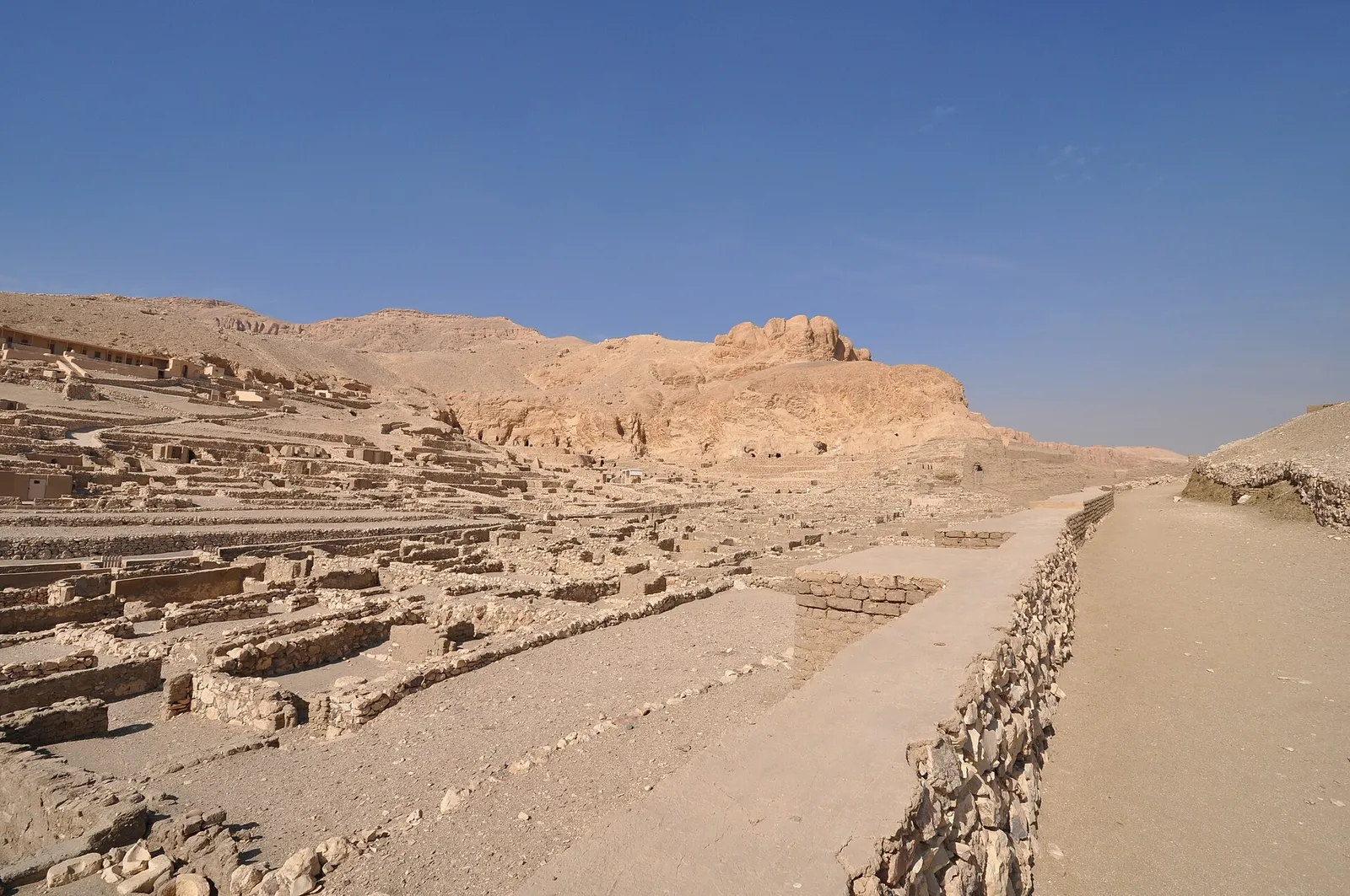 The main street of Deir el-Medina running between rows of house foundations