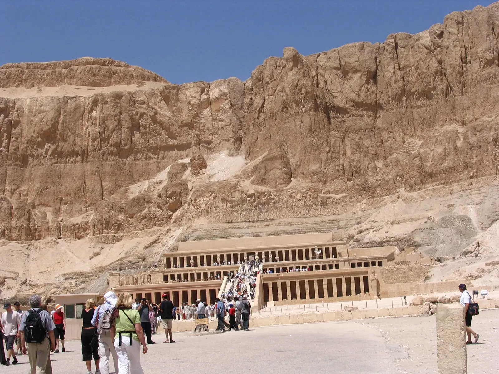 Hatshepsut's terraced temple under the cliffs, visitors in front