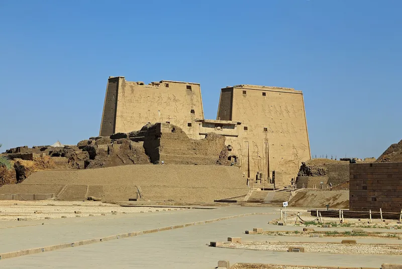 The pylon of Edfu temple rising above the mud-brick ruins of the old town