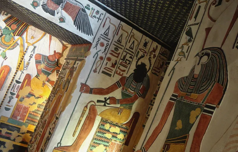 Brightly painted gods and hieroglyphs on the walls and starry ceiling of Nefertari's tomb