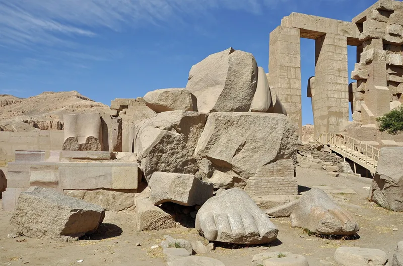 Fallen granite pieces of the Ramesses II colossus, including a giant foot, at the Ramesseum
