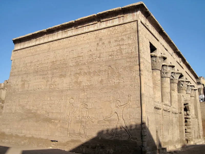 Corner of Esna temple with a large relief of a king striking his enemies